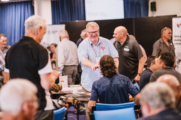 Gerard Wood engaged in a smiley conversation at a public event