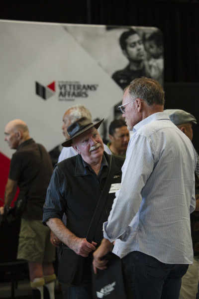 Two men talking at the Christchurch event